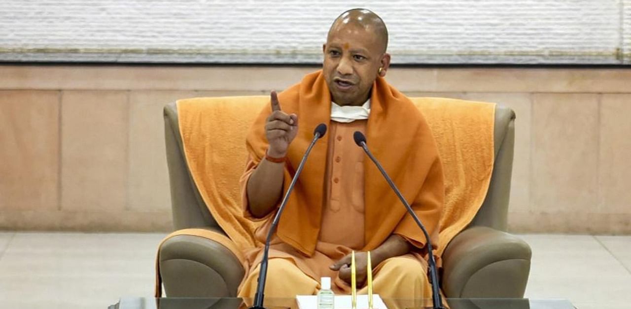 Uttar Pradesh CM Yogi Adityanath addresses media at his official residence in Lucknow. Credit: PTI Photo