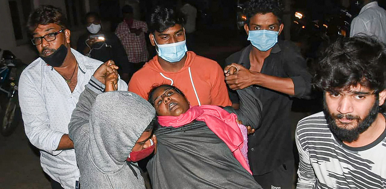 A woman showing symptoms of epilepsy being taken to a hospital in Eluru town of West Godavari district. Credit: PTI Photo