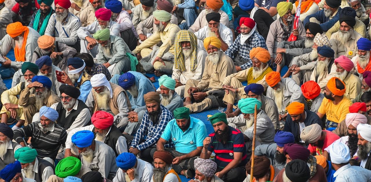Farmers during their agitation against the Center's new farm laws, at Singhu border in New Delhi. Credit: PTI Photo
