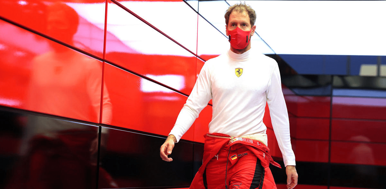 Ferrari's Sebastian Vettel in the garage during practice. Credit: Reuters Photo
