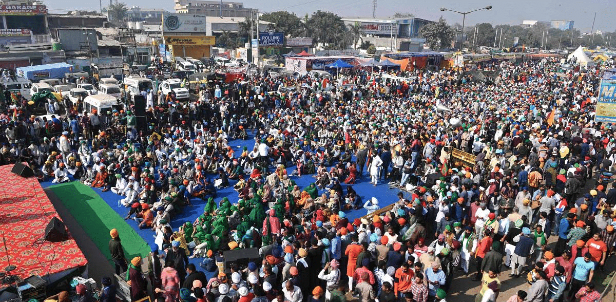 Farmers gather as they take part in a nationwide general strike to protest against the recent agricultural reforms at the Delhi-Haryana state border in Singhu. Credit: AFP Photo