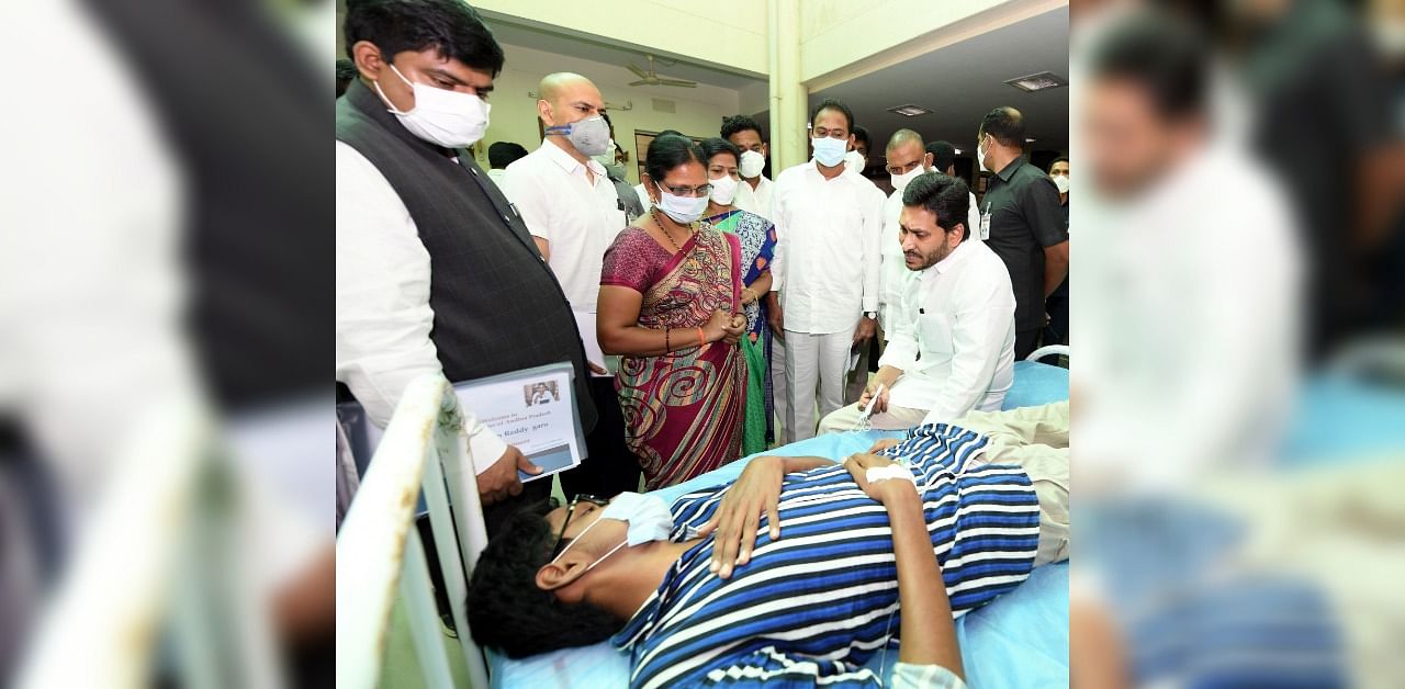 Andhra Pradesh CM Jaganmohan Reddy meets a victim of the mystery illness in Eluru. Credit: DH photo by arrangement.