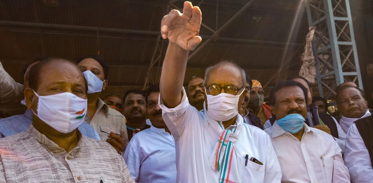 Congress leader and MP Digvijay Singh participates in a protest in support of the nationwide strike, called by farmers to press for repeal of the Centre's agri laws, in Indore. Credit: PTI Photo