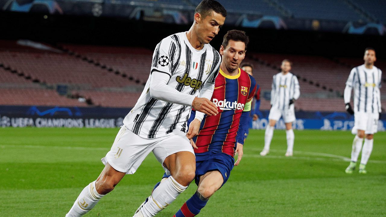 Lionel Messi in action with Juventus' Cristiano Ronaldo. Credit: Reuters Photo