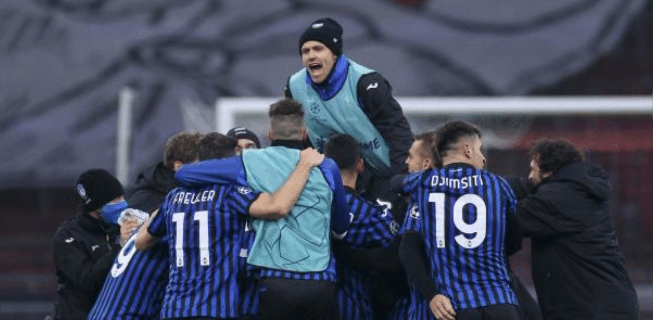 Atalanta's players celebrate after winning the UEFA Champions League Group D football match between Ajax Amsterdam and Atalanta Bergamo, at the Johan Cruijff stadium in Amsterdam. Credit: AFP