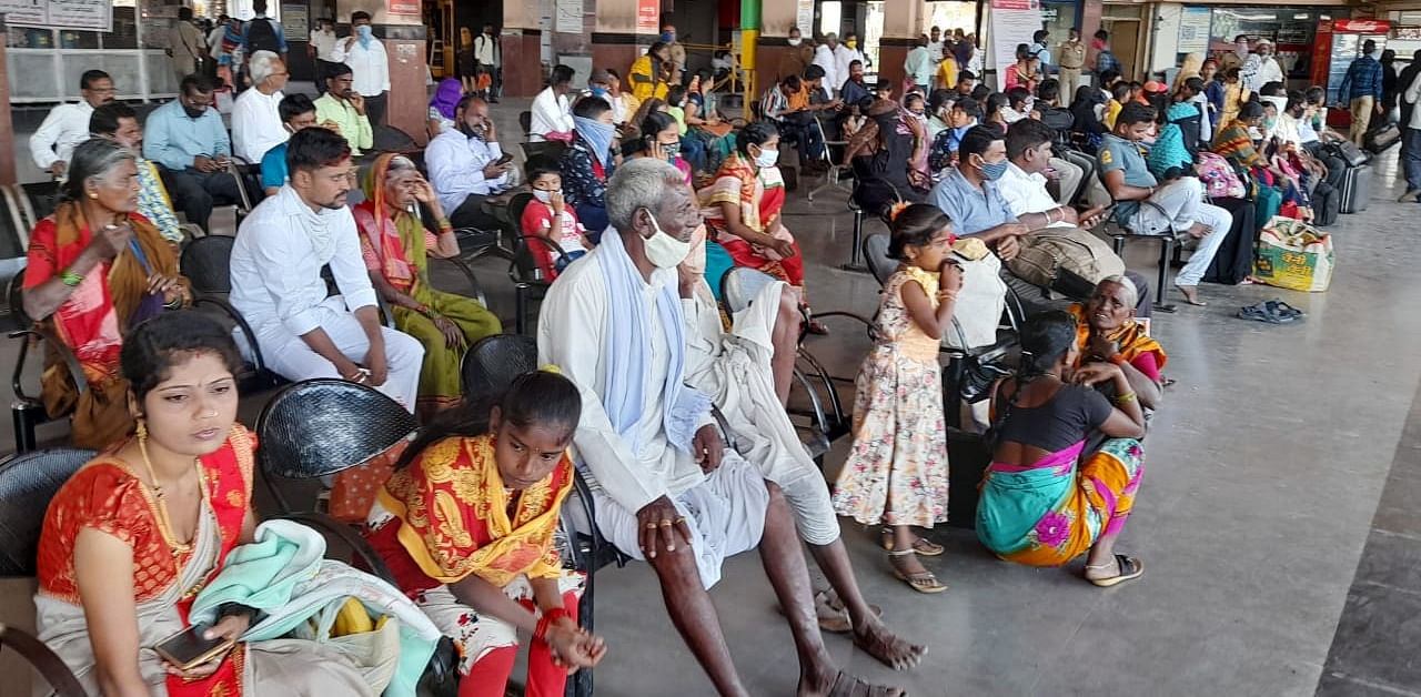 Commuters wait for buses at Central Bus Stand in Kalaburagi on Friday. Credit: DH Photo