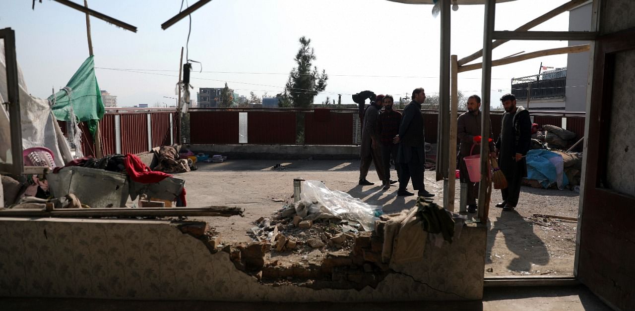 Afghans inspect a damaged house after a mortal shell attack in Kabul, Afghanistan on November 21, 2020. Multiple rockets were fired around Kabul residential areas. Credit: AP/PTI Photo