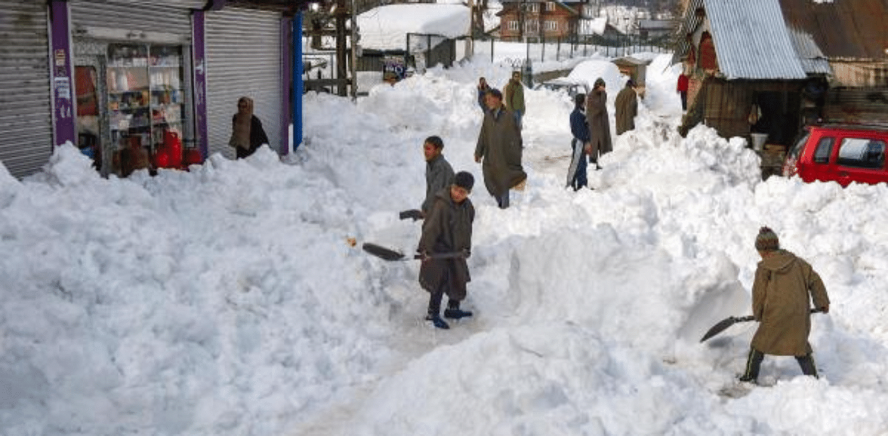 The 270-km Jammu-Srinagar National Highway was closed due to overnight snowfall and eight families were moved to safer locations after heavy rains triggered landslides in Gurmul village in Jammu and Kashmir's Doda district. Credit: PTI