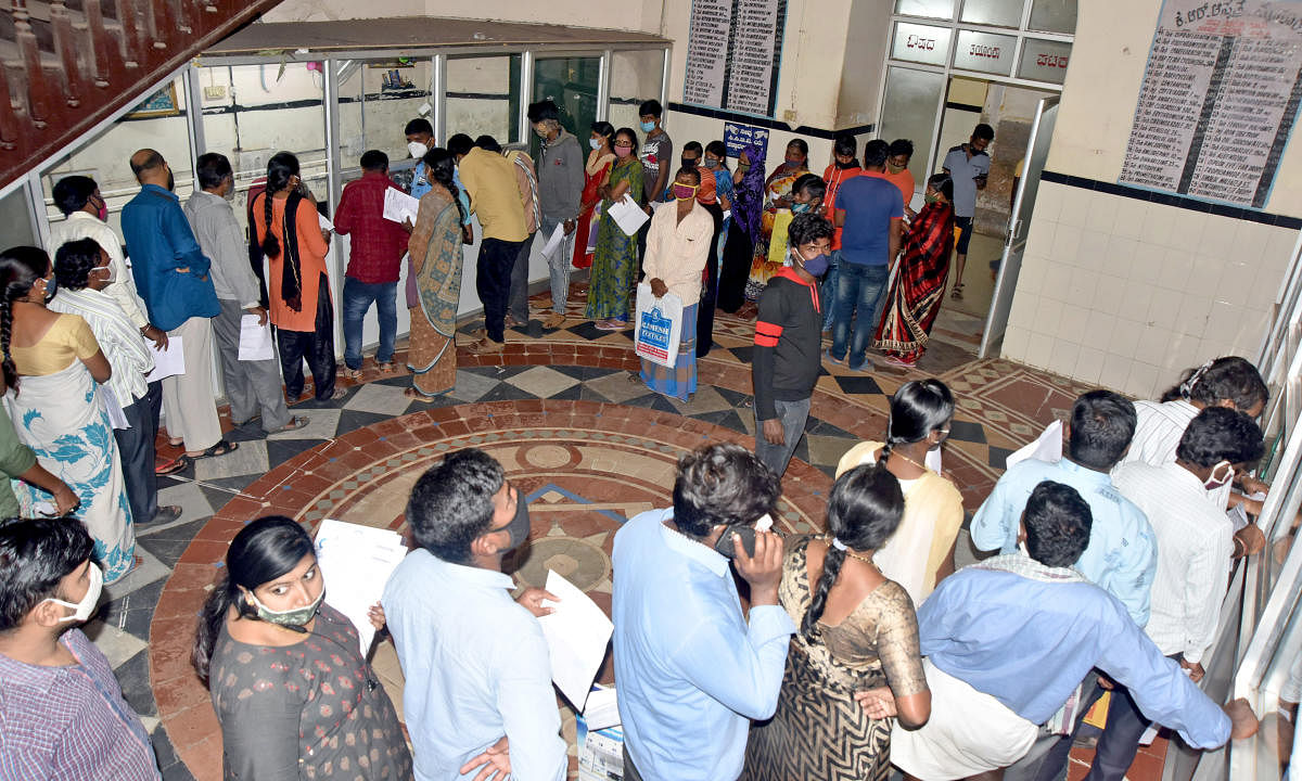 The outpatients wait at K R Hospital, in Mysuru, on Friday.