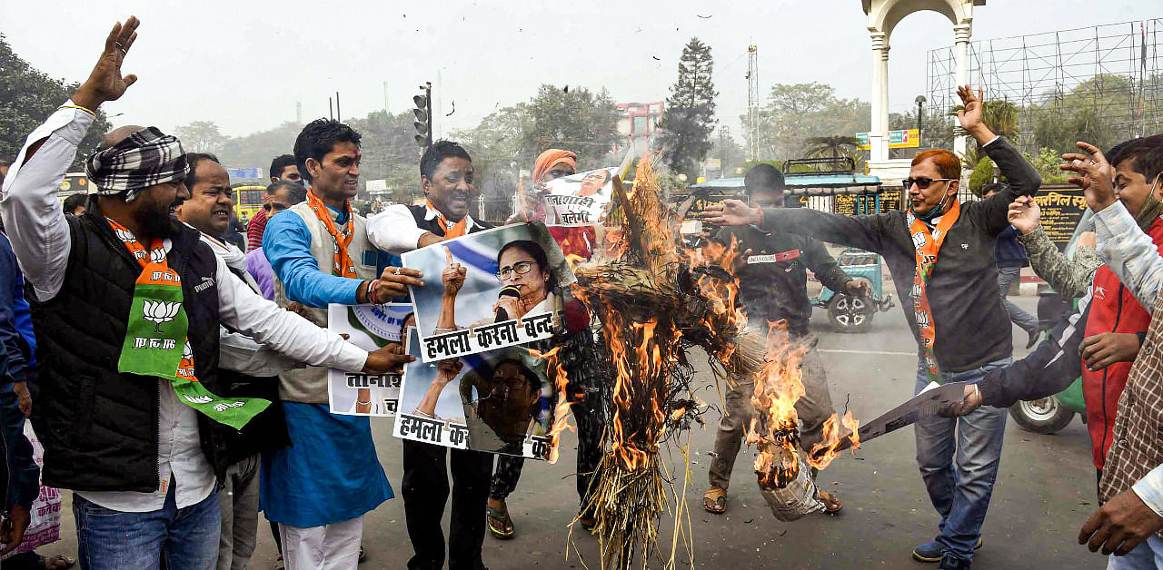BJP workers burn an effigy of West Bengal Chief Minister Mamta Banerjee during a protest against the attack on party National President JP Nadda's convoy in West Bengal yesterday. Credit: PTI Photo
