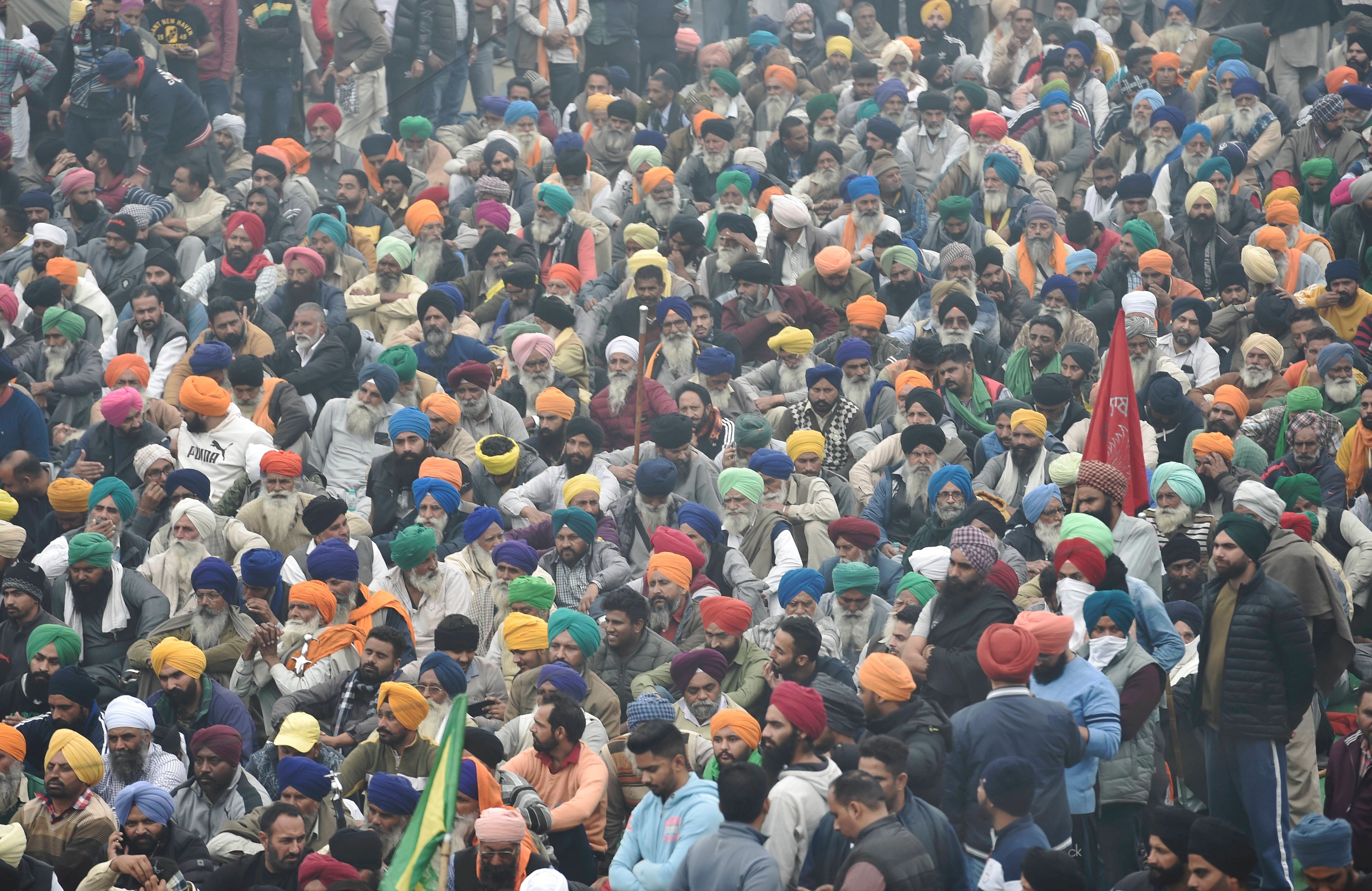  Farmers gather in large numbers at Singhu border during their 'Delhi Chalo' protest march against the new farm laws, in New Delhi, Saturday, Dec. 12, 2020. Credit: PTI Photo