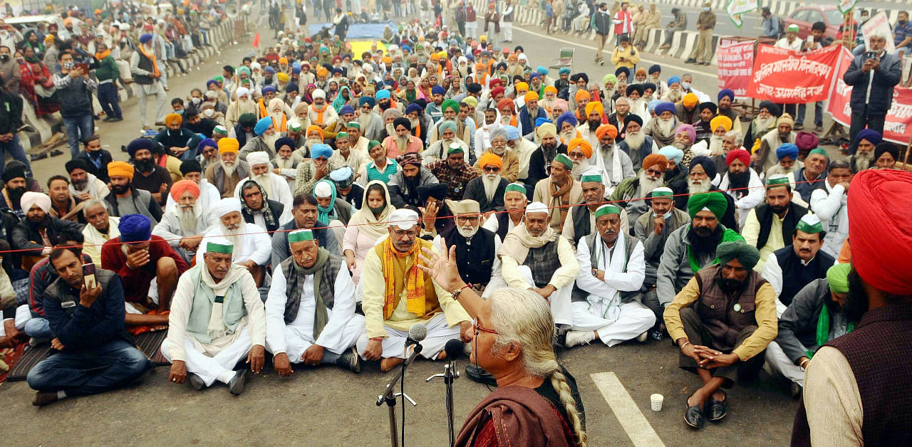 Social activist Medha Patkar addresses farmers during their protest against the new farm laws, at Ghazipur border in Delhi. Credit: PTI Photo