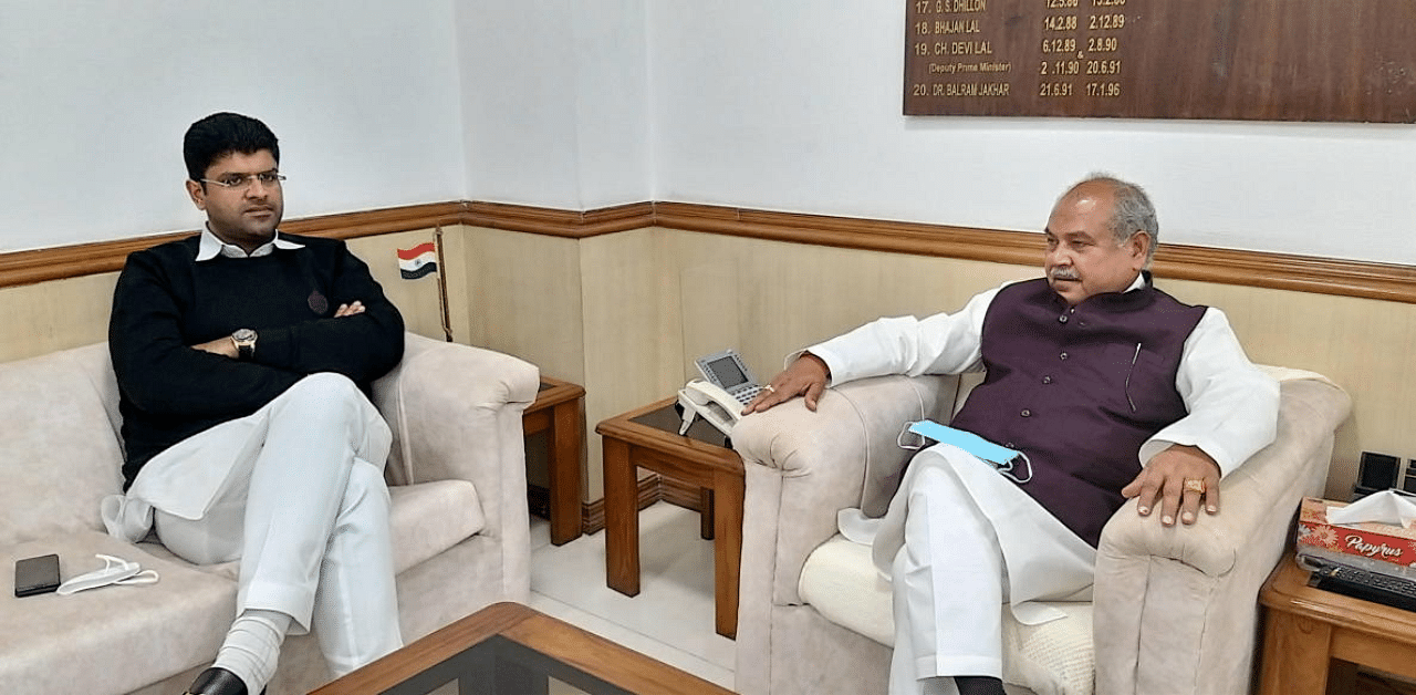 Haryana Deputy Chief Minister Dushyant Chautala with Union Agriculture Minister Narendra Singh Tomar during a meeting on farmers' agitation over farm laws, in New Delhi. Credit: PTI Photo