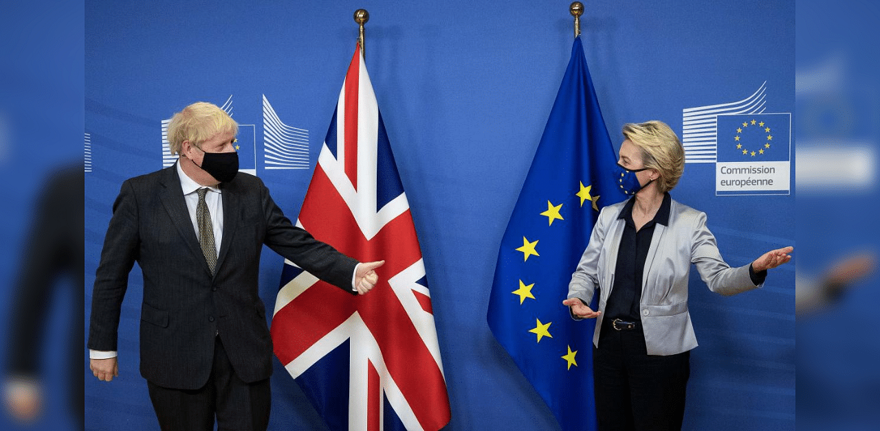 Britain's Prime Minister Boris Johnson (L) is welcomed by European Commission President Ursula von der Leyen in the Berlaymont building at the EU headquarters in Brussels on December 9, 2020, prior to a post-Brexit talks' working dinner. Credit: AFP Photo
