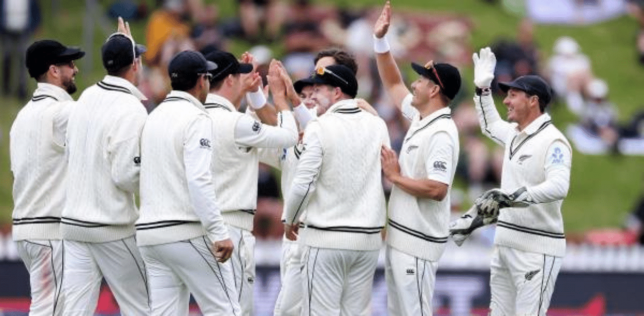 New Zealand players celebrate the dismissal of West Indies batsman Kraigg Brathwaite on day three of the second cricket Test match between New Zealand and the West Indies at the Basin Reserve in Wellington. Credit: AFP
