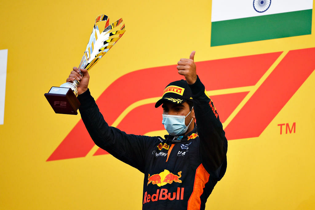 Race winner Jehan Daruvala of India and Carlin celebrates on the podium during the Round 12:Sakhir Sprint Race of the Formula 2 Championship at Bahrain International Circuit on December 06, 2020 in Bahrain, Bahrain. Credit: Getty Images
