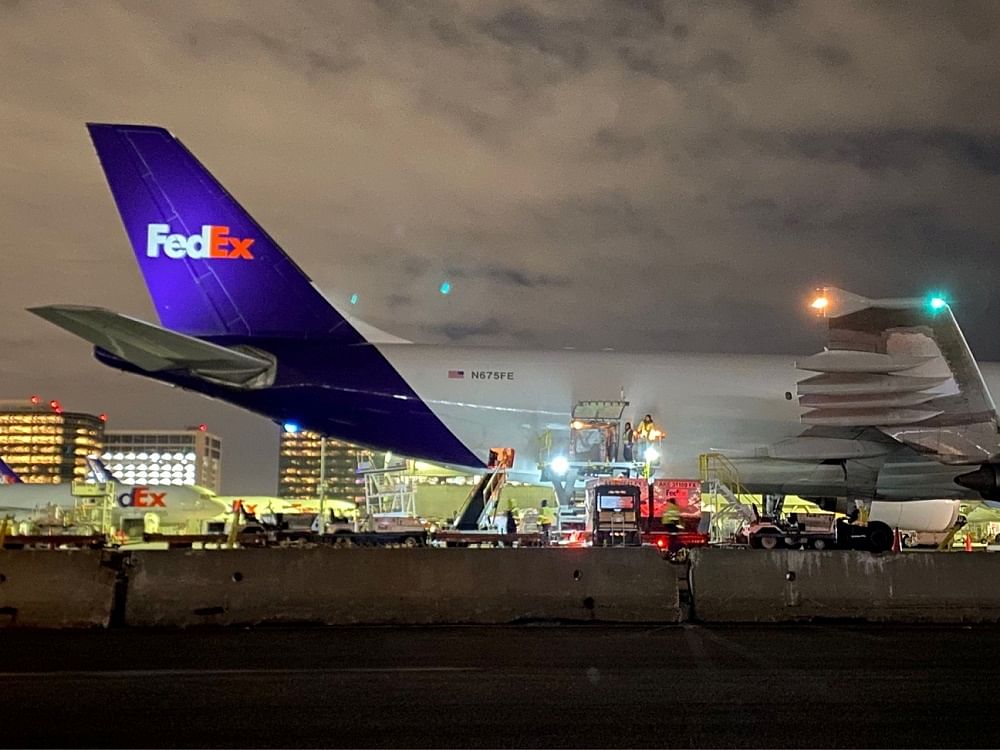 A plane of FedEx Express carrying a first batch of Pfizer/BioNTEch Covid-19 vaccine is seen at LAX Airport, in Los Angeles. Credit: Reuters Photo