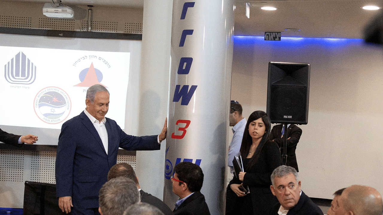 Israel Prime Minister Benjamin Netanyahu stands next to an Arrow-3 ballistic missile interceptor. Credit: Reuters Photo