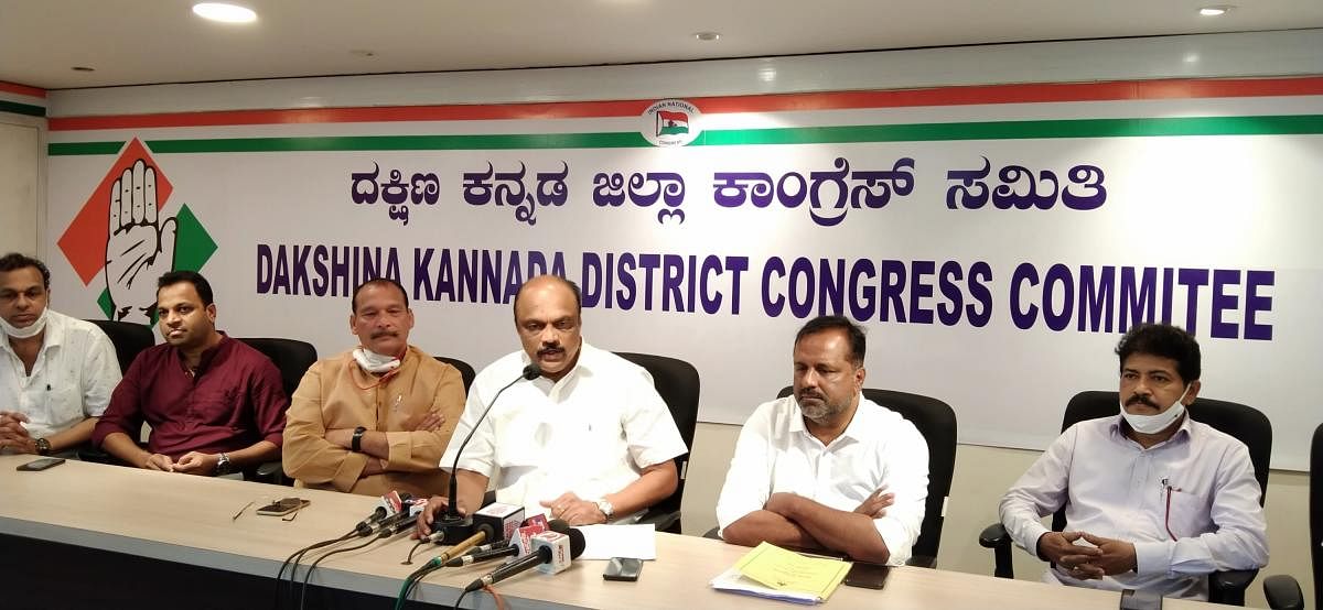 District Congress Committee President Harish Kumar speaks to media persons in Mangaluru on Monday.