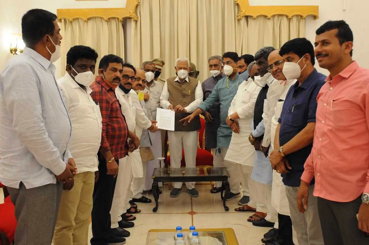 The BJP-JD(S) combine petitioned Governor Vajubhai R Vala on Tuesday following the ruckus in the Legislative Council. Credit: Special Arrangement