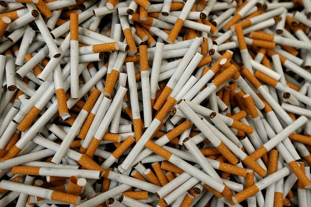 Cigarettes are seen during the manufacturing process. Credit: Reuters Photo