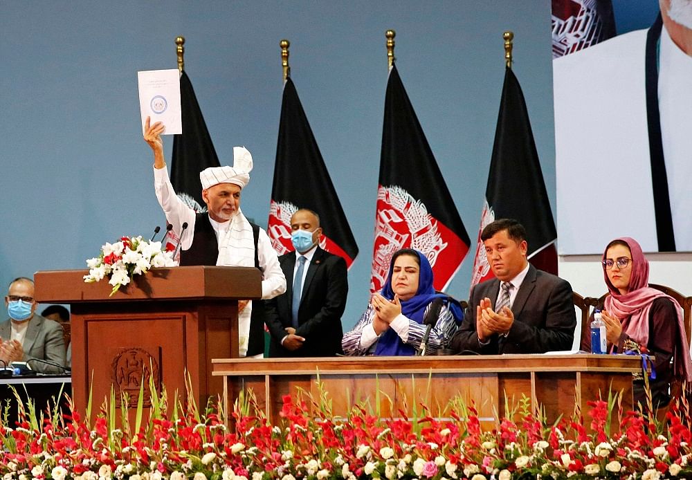 Afghan President Ashraf Ghani holds up the resolution on the last day of an Afghan Loya Jirga or traditional council, in Kabul, Afghanistan. Credit: Reuters Photo