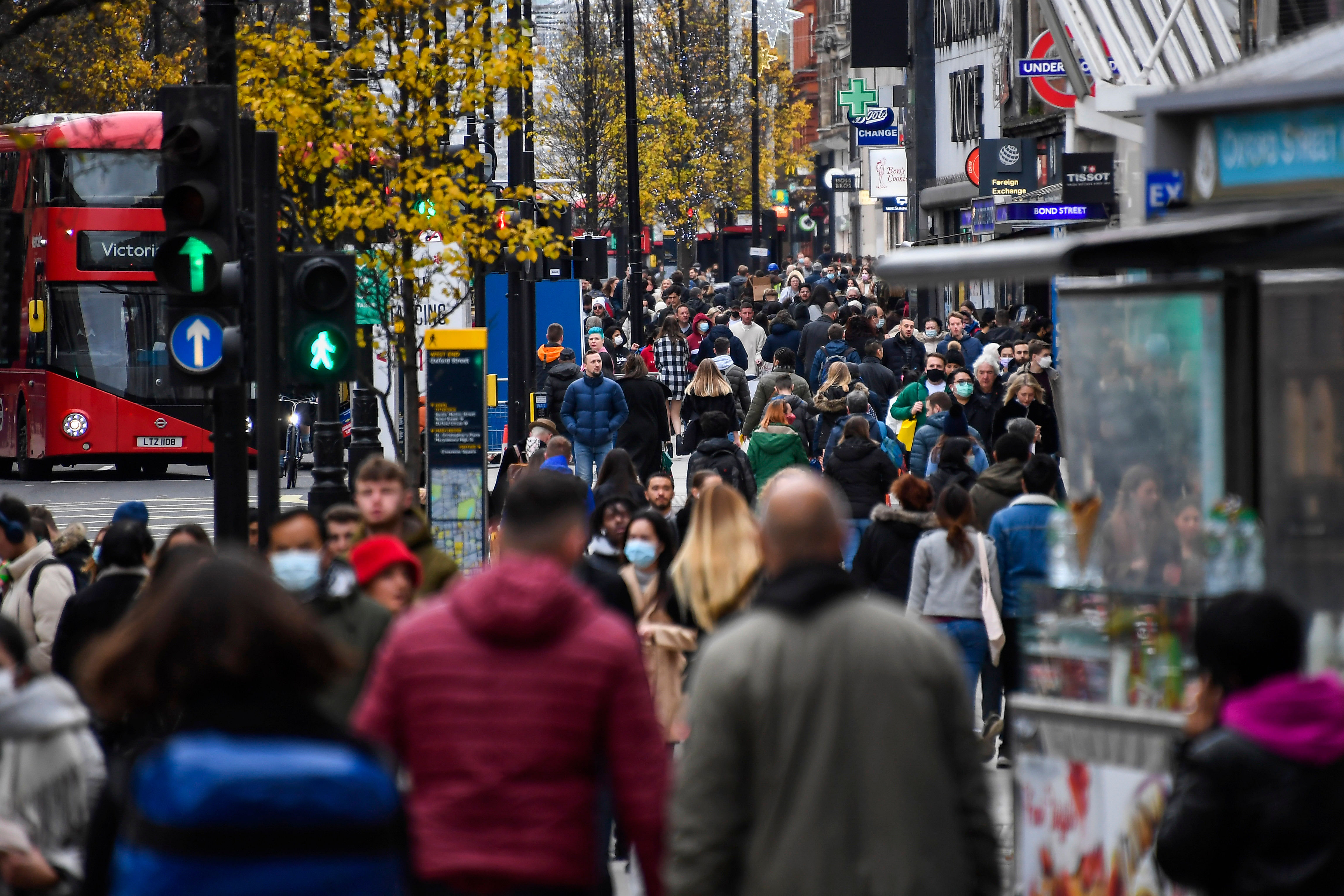 People walk in the main shopping area at Oxford Street, in London. Credit: AP Photo