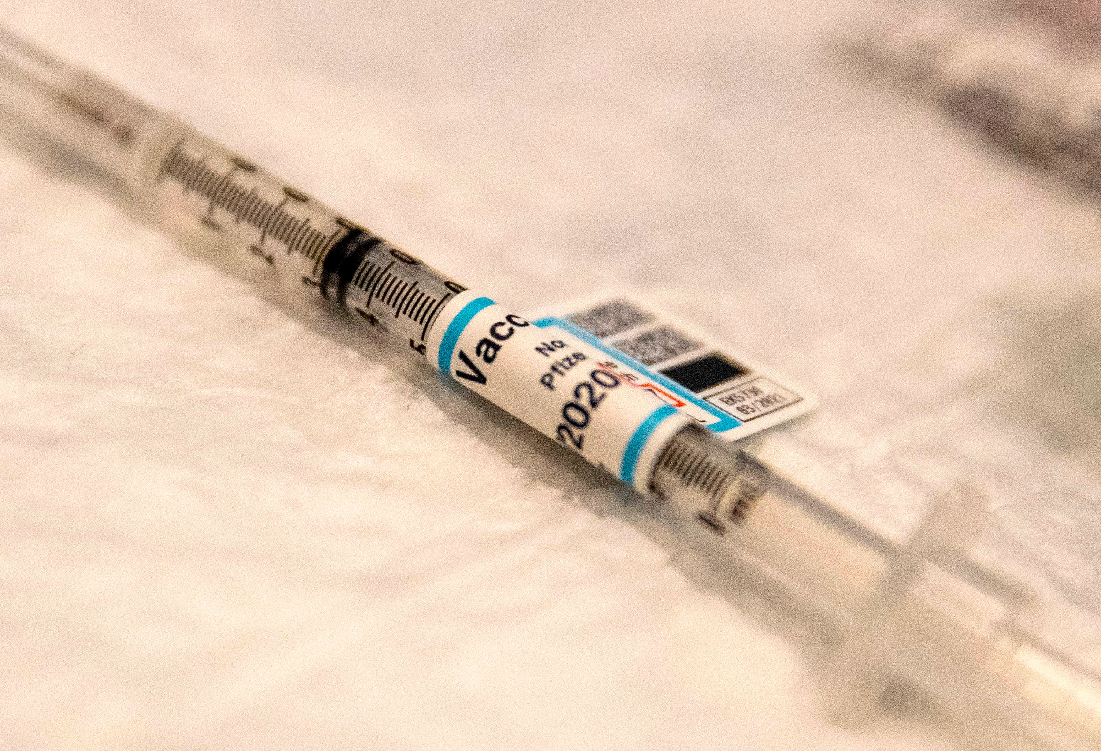 A syringe of Covid-19 vaccine is ready on a table at Ronald Reagan UCLA Medical Center in Westwood, California on December 16, 2020. Credit: AFP Photo