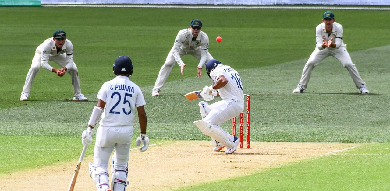 India's batsman Mayank Agarwal ducks under a bouncer on day one of the First cricket Test match between Australia and India in Adelaide on December 17, 2020. Credit: AFP Photo