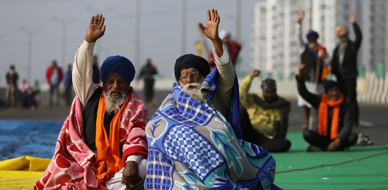 Farmers take part in a protest against the newly passed farm laws at Delhi-Uttar Pradesh border on the outskirts of Delhi. Credit: Reuters Photo