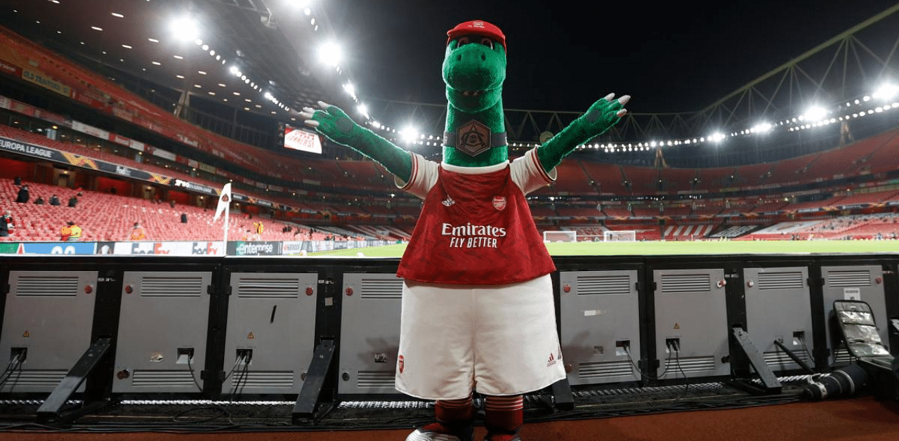 Jerry Quy, the man who for 27 years had thrown off the shackles of self-respect by dressing up each week as the dainty dinosaur, was made redundant in the wake of the coronavirus, only for out-of-favour midfielder Mesut Ozil to curry favour by offering to pay his wages. Credit: AFP