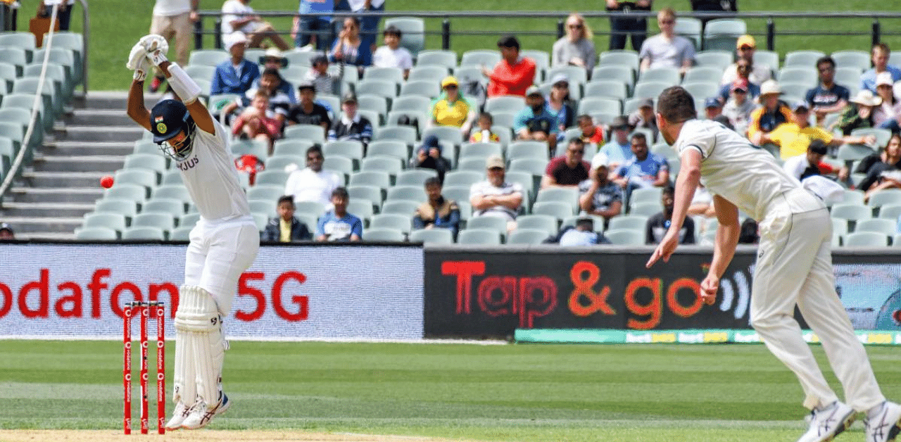 Indian batsman Cheteshwar Pujara avoids a ball on day one of the first cricket Test match between Australia and India in Adelaide. Credit: AFP Photo