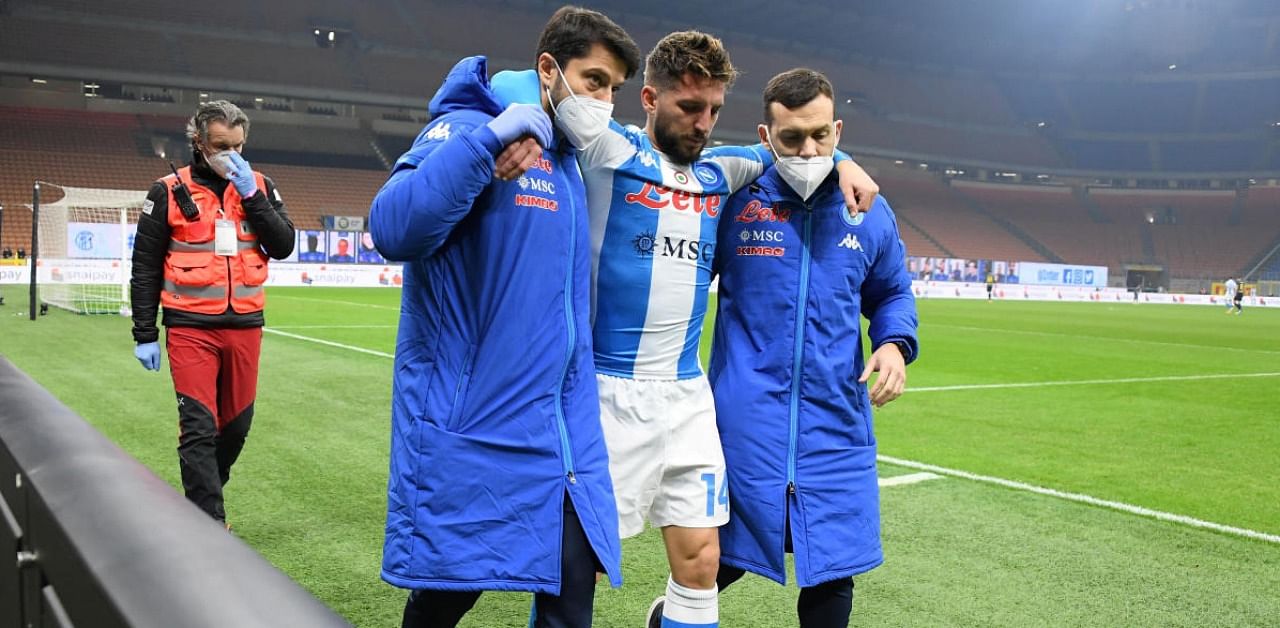Napoli's Dries Mertens receives medical attention after sustaining an injury. Credit: Reuters.