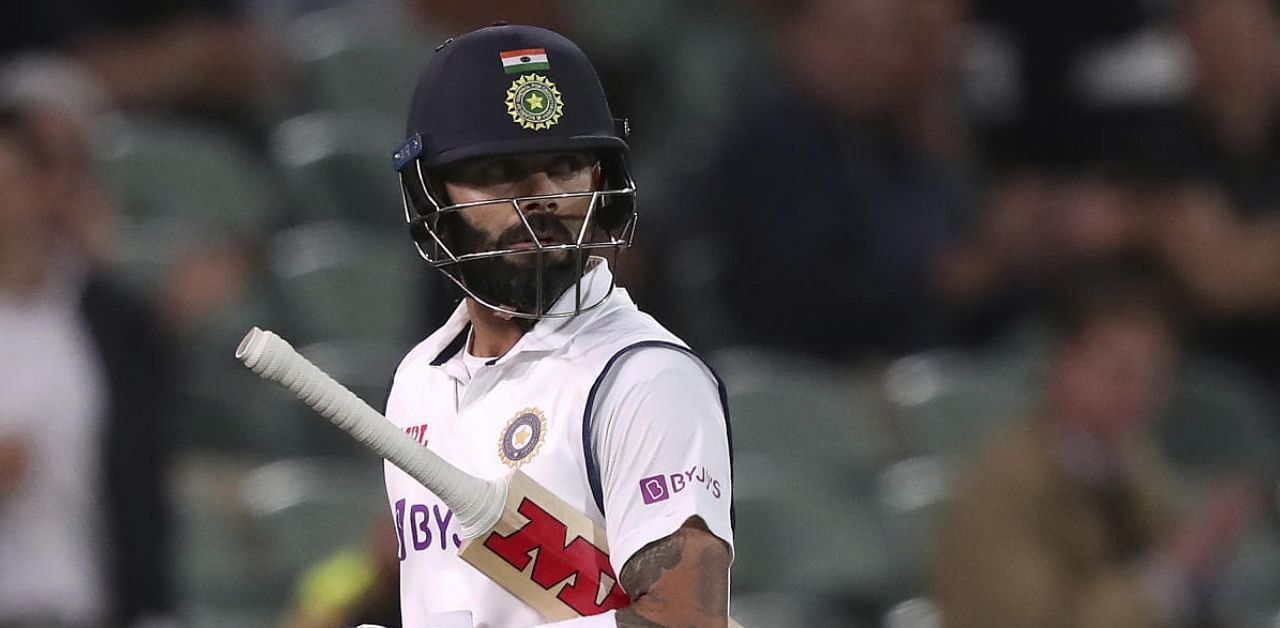 Virat Kohli walks off after he was run-out by Australia for 74 runs during their cricket test match at the Adelaide Oval in Adelaide, Australia. Credit: AP/PTI.
