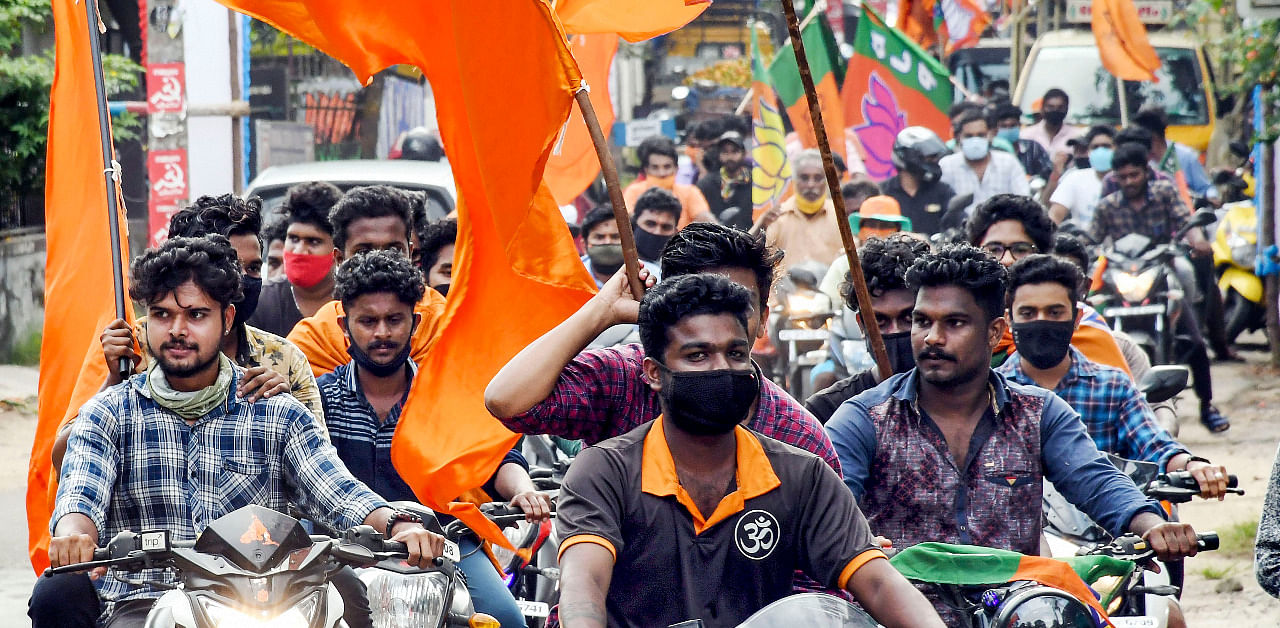 BJP supporters celebrate their party's lead in the Kerala local body elections in Thiruvananthapuram. Credit: PTI Photo