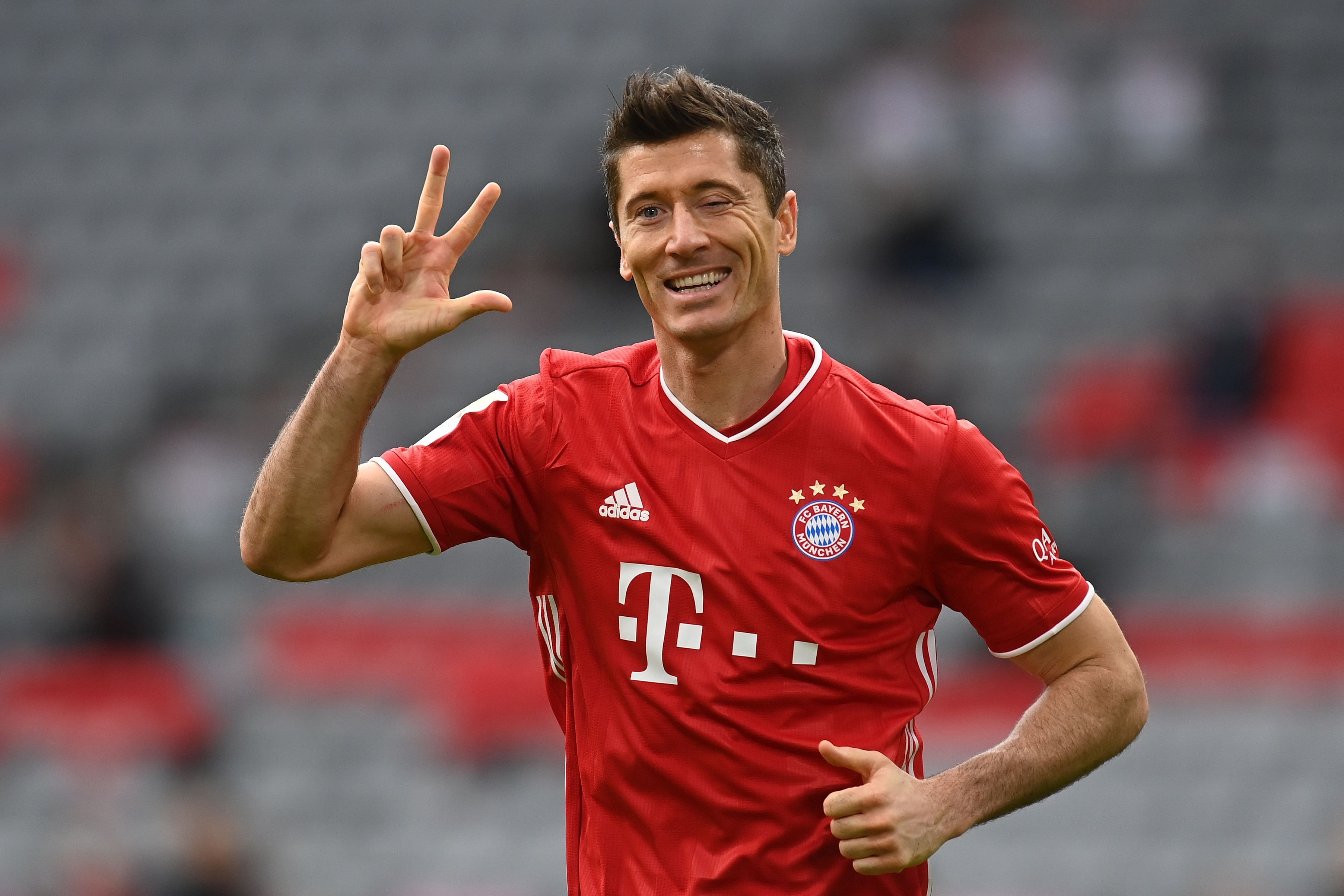 Bayern Munich's Polish forward Robert Lewandowski celebrates scoring the 3-0 goal for his hat-trick during the German first division Bundesliga football match between FC Bayern Munich and Eintracht Frankfurt in Munich, southern Germany. - Bayern Munich striker Robert Lewandowski was named men's player of the year on December 17, 2020 at the FIFA's 'The Best' awards ceremony in Zurich. The 32-year-old Polish forward, top scorer in Europe and winner of the Champions League with Bayern, came out ahead of the other two nominees, Lionel Messi and Cristiano Ronaldo. Credit: AFP File Photo