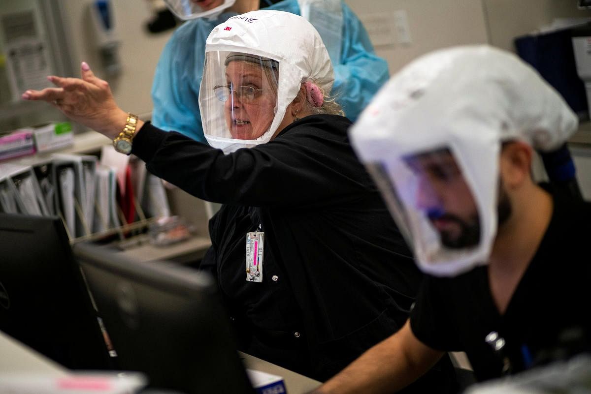 Healthcare personnel work inside a coronavirus disease (COVID-19) unit at Trinitas Regional Medical Center in Elizabeth, New Jersey, U.S., December 16, 2020. Credit: REUTERS