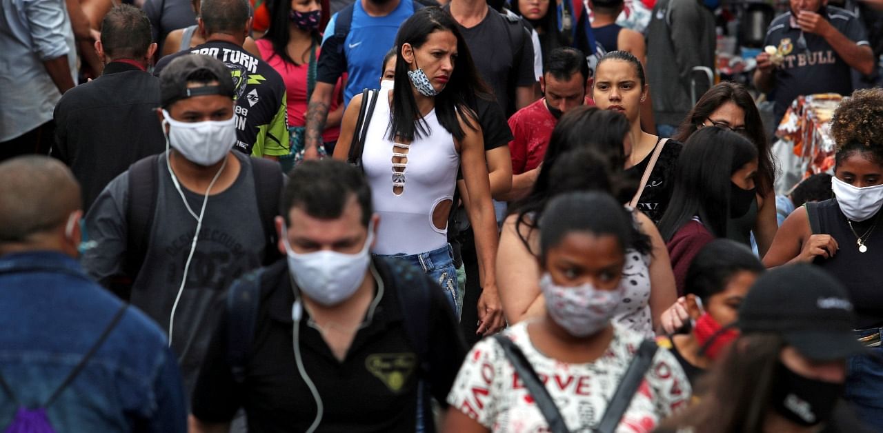 People walk at a popular shopping street amid the coronavirus disease outbreak in Sao Paulo, Brazil. Credit: Reuters Photo