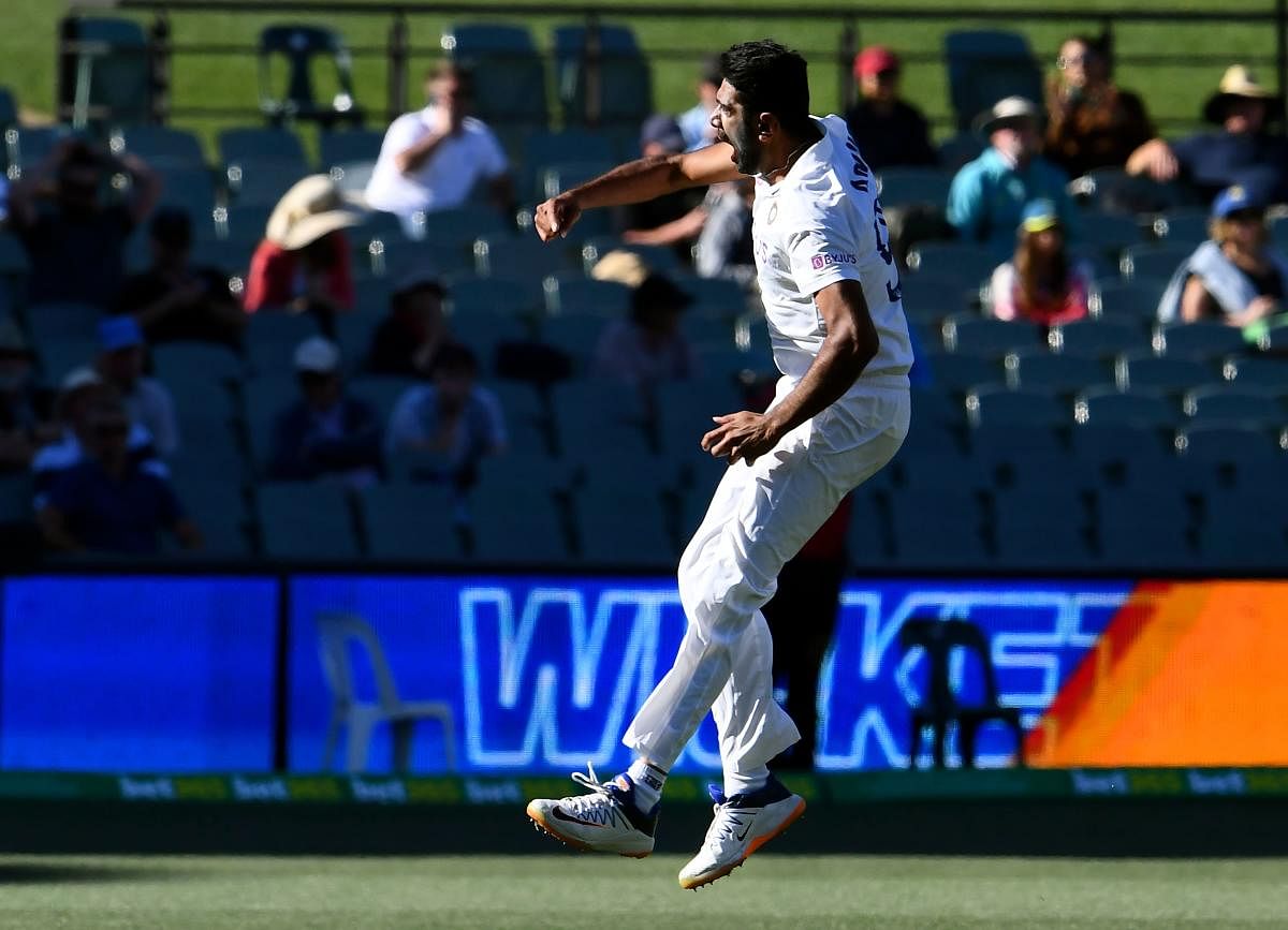 Ravi Ashwin celebrates after dismissing Australia's Steve Smith during the second day of the first cricket Test match between Australia and India played in Adelaide. Credit: AFP Photo. 