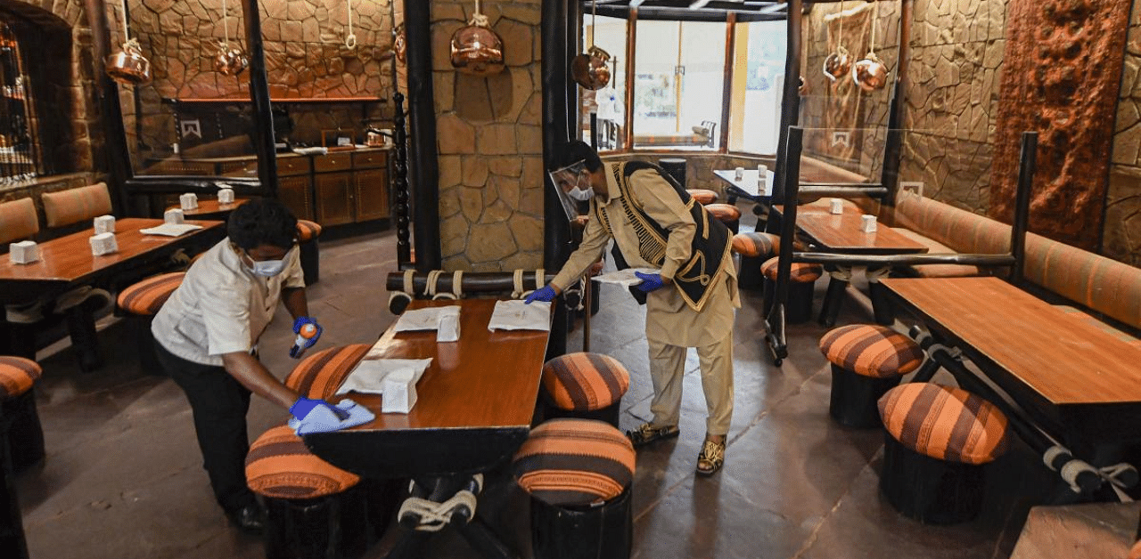 Hotel staff carry out sanitation work at Bukhara restaurant of ITC Maurya Hotel, in New Delhi. Credit: PTI