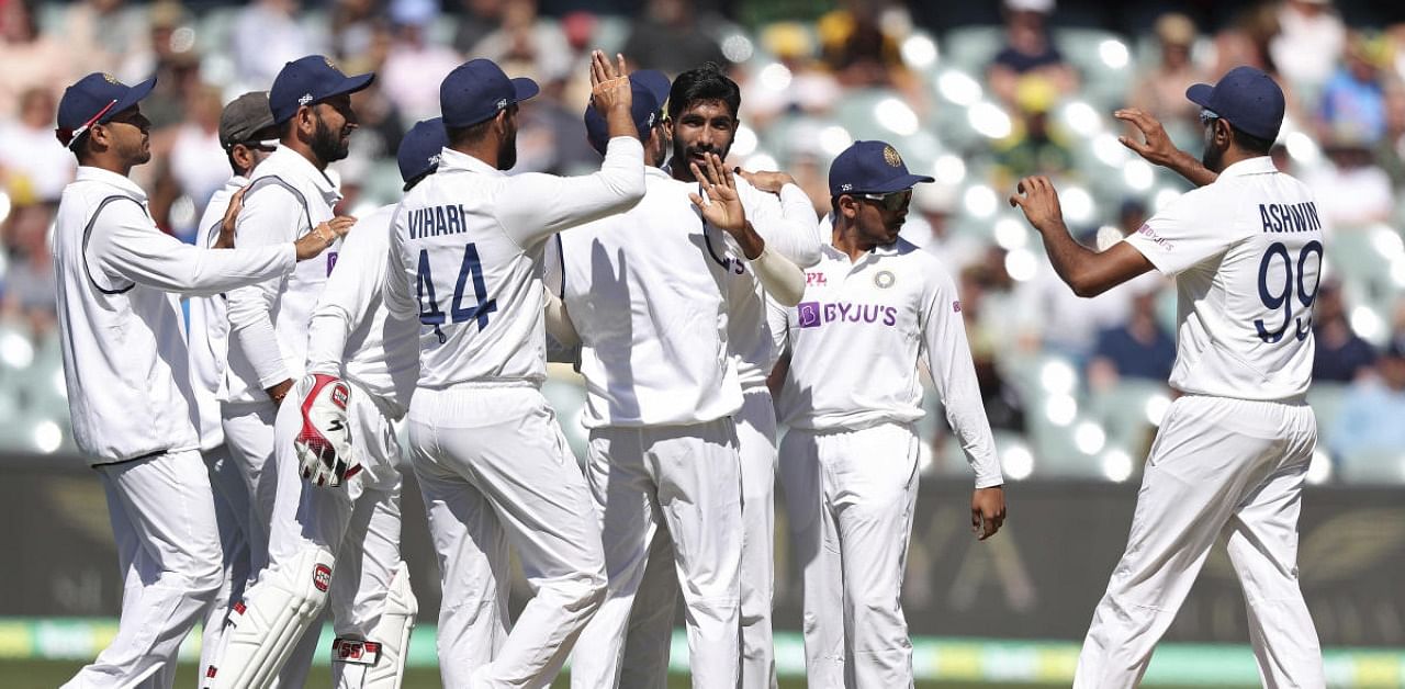 India's players celebrate the wicket of Australia's Matthew Wade on the second day of their cricket test match at the Adelaide Oval in Adelaide, Australia, Friday, Dec. 18, 2020. Credit: AP/PTI Photo