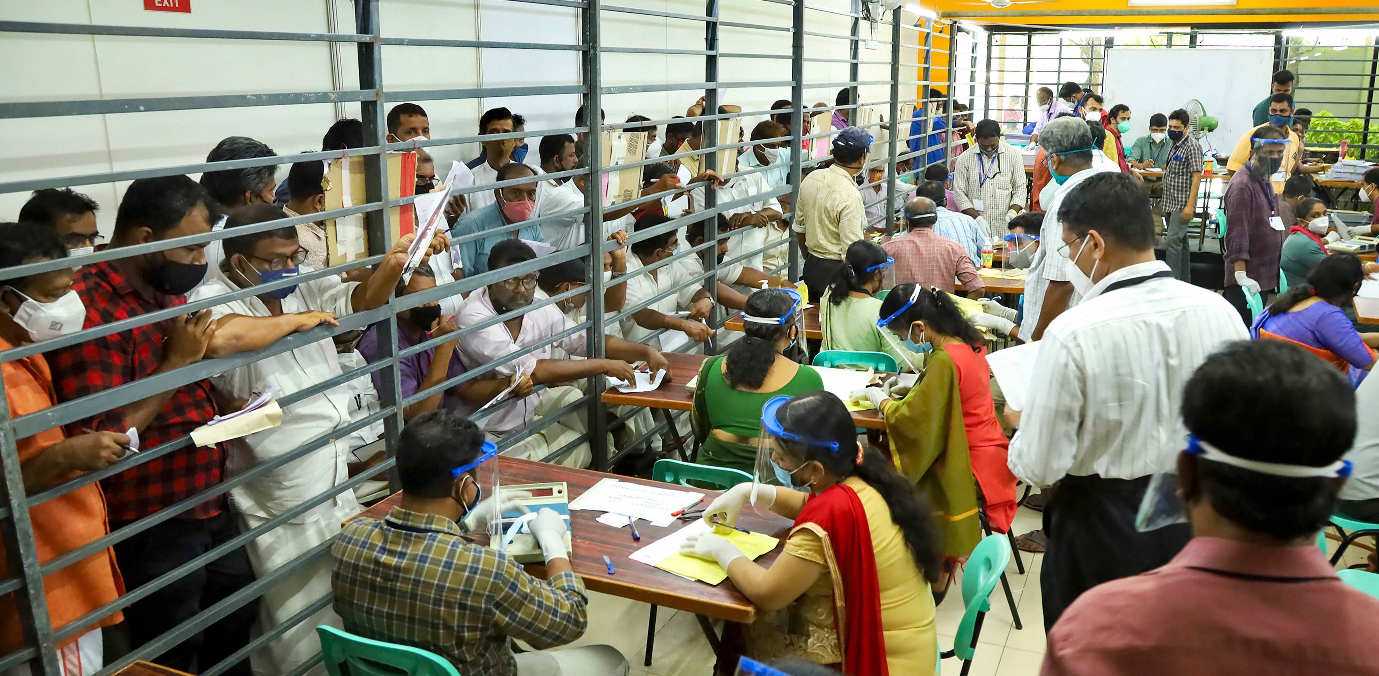 Officials count votes during counting day of Kerala local body elections, in Kozhikode. Credit: PTI