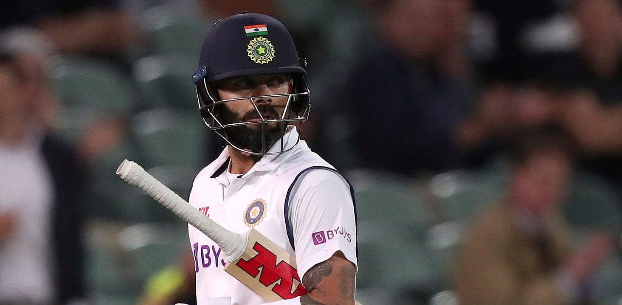 India's Virat Kohli walks off after he was run-out by Australia for 74 runs during their cricket test match at the Adelaide Oval in Adelaide, Australia. Credit: AP/PTI Photo