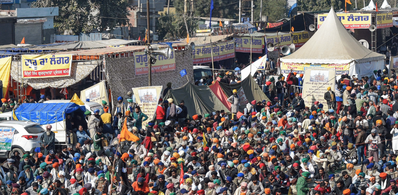 Farmers gather in large numbers during a protest against the new farm laws, at Kundli border in Sonipat. PTI Photo