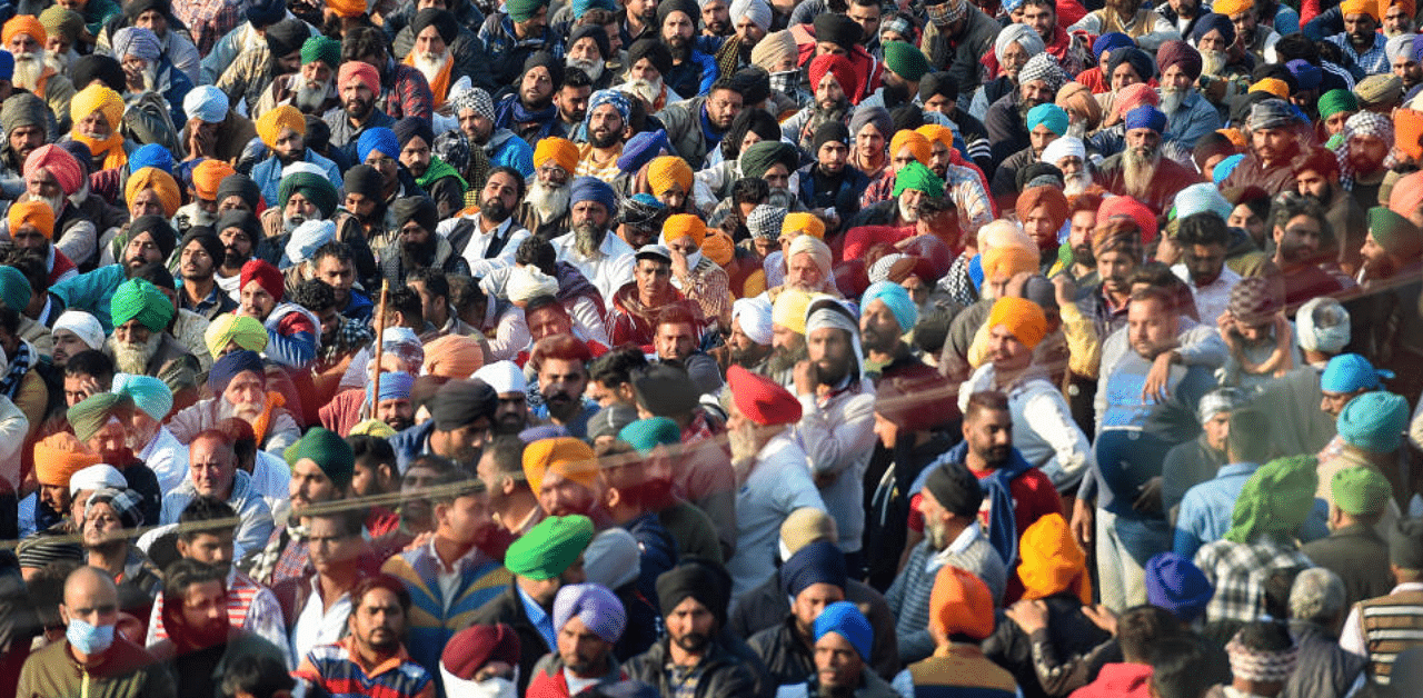  Farmers during their protest against the Center's new farm law at Delhi-Haryana, Singhu border,in New Delhi, Friday, Dec. 18, 2020. Credit: PTI Photo