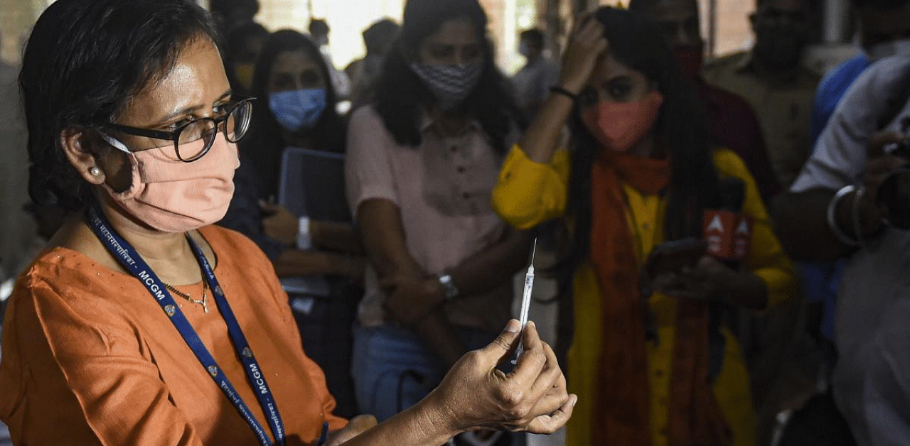 Dr Sheela Jagtap from Immunisation Department of BMC demonstrates the storage and use of syringes as a part of preparations and implementation of Covid-19 vaccine, in Mumbai. Credit: PTI