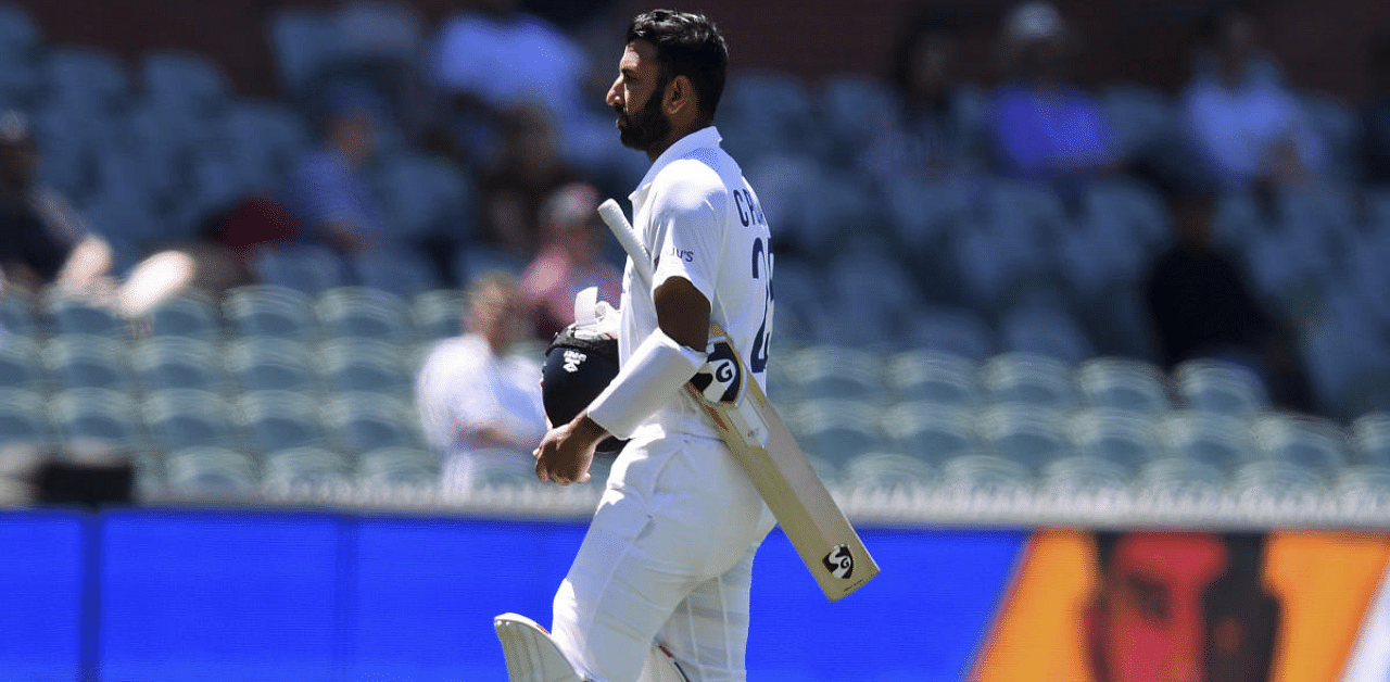 Adelaide:India's Cheteshwar Pujara walks off after he lost his wicket to Australia's Pat Cummins on the third day of their cricket test match at the Adelaide Oval in Adelaide. Credit: AP Photo