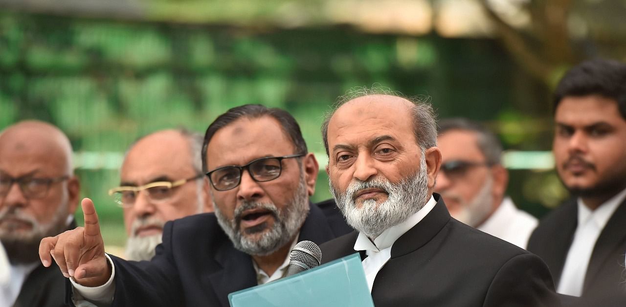 Sunni Central Waqf Board's lawyer Zafaryab Jilani along with other advocates addresses a press conference after the Supreme Court verdict on the Ayodhya case. Credit: PTI Photo