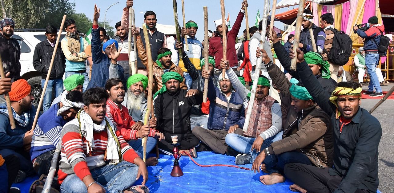 Farmers block Delhi-Noida border at Chilla point as they participate in a sit-in protest against Centre's farm reform laws. Credit: PTI Photo