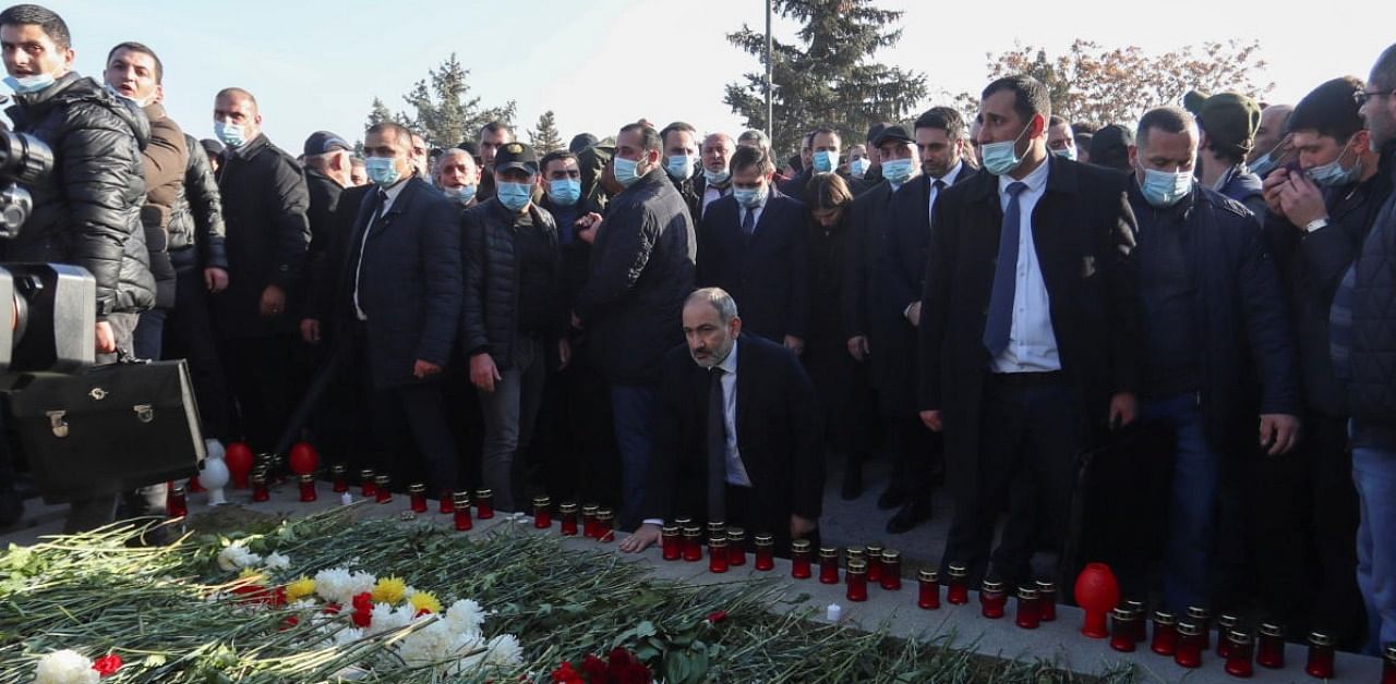 Armenian Prime Minister Pashinyan visits a military cemetery on the day of nationwide mourning in Yerevan. Credit: Reuters.